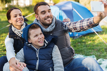 Image showing family with smartphone taking selfie at campsite