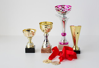 Image showing close up of sports golden cups and medals