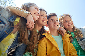 Image showing happy teenage students or friends outdoors