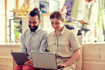 Image showing creative team with tablet pc and laptop in office