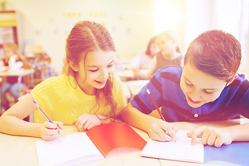 Image showing group of school kids writing test in classroom