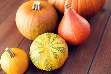 Image showing close up of pumpkins on wooden table at home