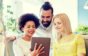 Image showing happy creative team with tablet pc in office