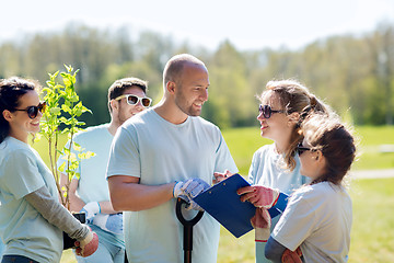 Image showing group of volunteers planting trees in park