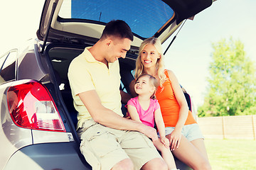 Image showing happy family with hatchback car outdoors