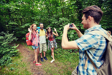 Image showing friends with backpack taking selfie by smartphone