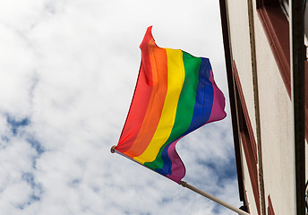 Image showing close up of rainbow gay pride flag waving on building