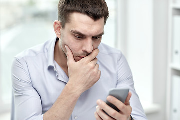 Image showing close up of businessman with smartphone