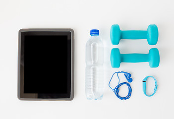 Image showing tablet pc, dumbbells, earphones and bottle