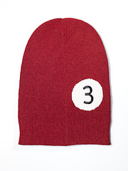 Image showing red woolen handmade cap basketball ball alike