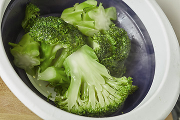 Image showing natural pieces of green healthy broccoli just steamed