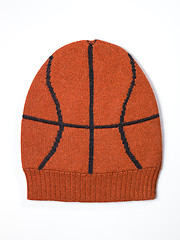 Image showing orange woolen handmade cap basketball ball alike