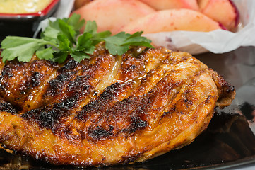 Image showing plate of grilled meat with fries