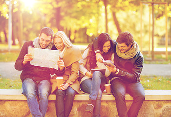 Image showing couples with tourist map in autumn park