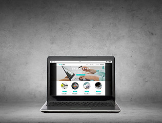 Image showing laptop computer with online shop page on screen