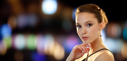 Image showing beautiful young asian woman with diamond earring