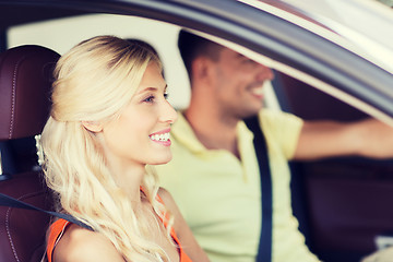 Image showing happy man and woman driving car