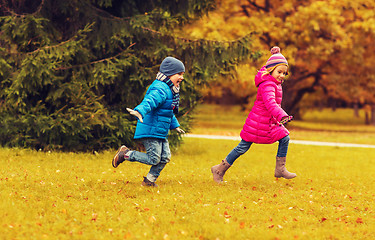 Image showing group of happy little kids running outdoors