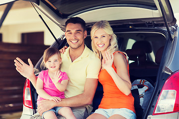 Image showing happy family with hatchback car at home parking