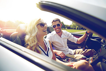 Image showing happy man and woman driving in cabriolet car