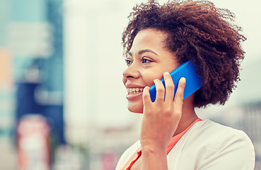 Image showing happy young african american businesswoman in city