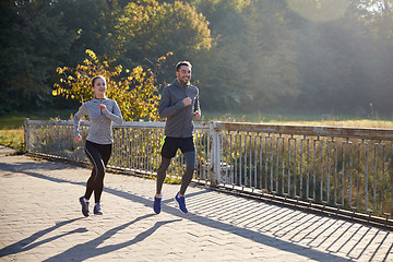 Image showing happy couple running outdoors