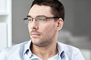 Image showing portrait of businessman in eyeglasses at office