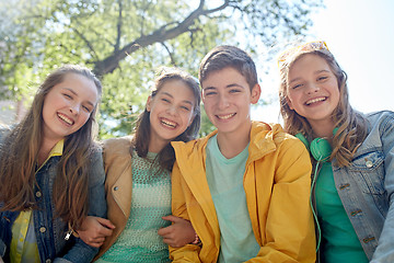 Image showing happy teenage students or friends outdoors