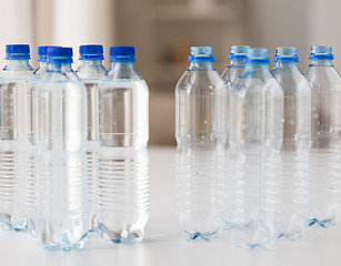 Image showing close up of bottles with drinking water on table