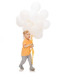 Image showing happy little baby boy with bunch of balloons