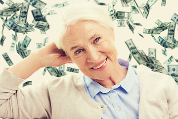 Image showing happy senior woman face over violet background