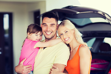 Image showing happy family with hatchback car at home parking