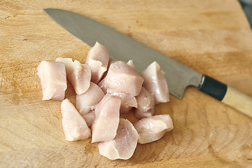 Image showing chicken breast chopped up with japanese knife on table