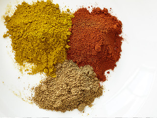 Image showing different spices paprika curry garam massala in white table