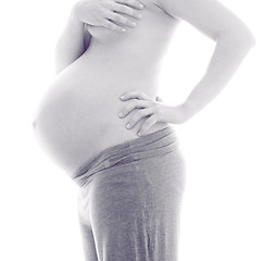 Image showing Pregnant Woman holding her hands on beautiful belly