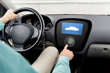 Image showing close up of man in car with starter on computer