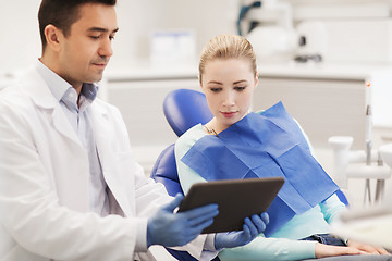 Image showing male dentist with tablet pc and woman patient