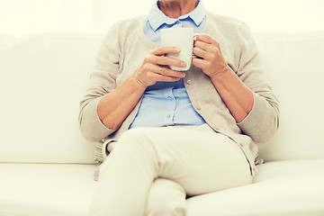 Image showing close up of senior woman with tea cup at home