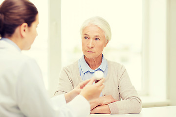 Image showing doctor with medicine and senior woman at hospital