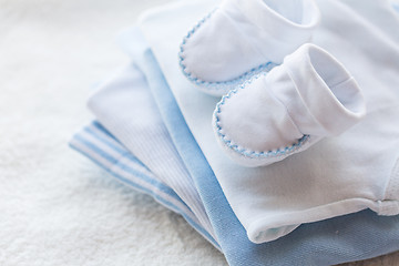 Image showing close up of baby boys clothes for newborn on table