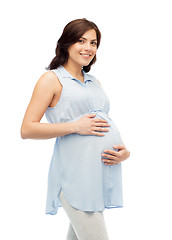 Image showing happy pregnant woman touching her big belly