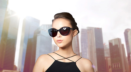 Image showing beautiful young woman in elegant black sunglasses