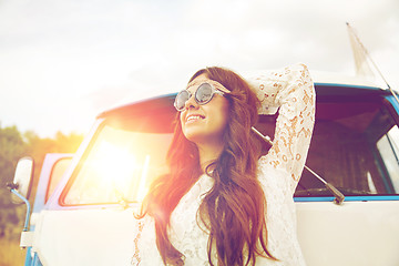 Image showing smiling young hippie woman in minivan car