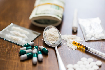 Image showing close up of drugs, money, spoon and syringe