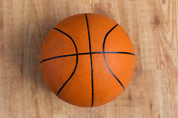 Image showing close up of basketball ball on wooden floor