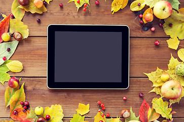 Image showing tablet pc with autumn leaves, fruits and berries