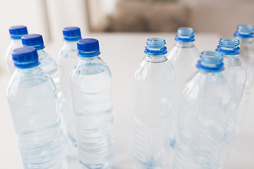 Image showing close up of bottles with drinking water on table