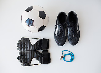 Image showing close up of soccer ball, gloves, whistle and boots