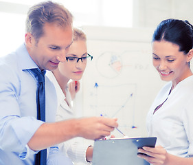 Image showing business team discussing something in office