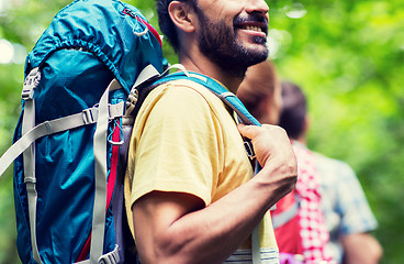 Image showing close up of friends with backpacks hiking